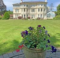 White Victorian mansion amid spacious lawns